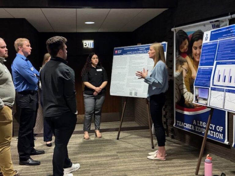 students presenting poster