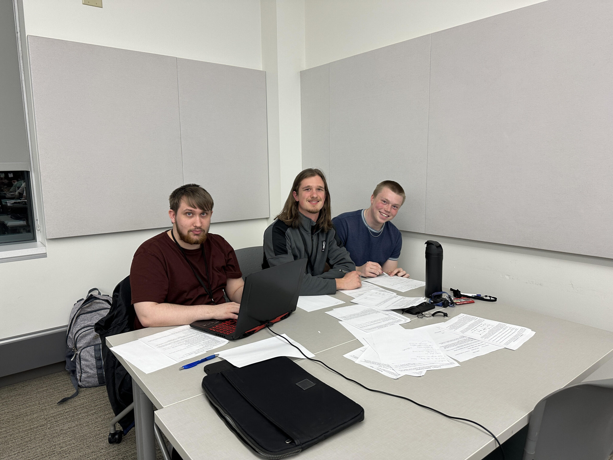 Lucas Heindel, Luke Rickert and Joseph Hakanson working on programs