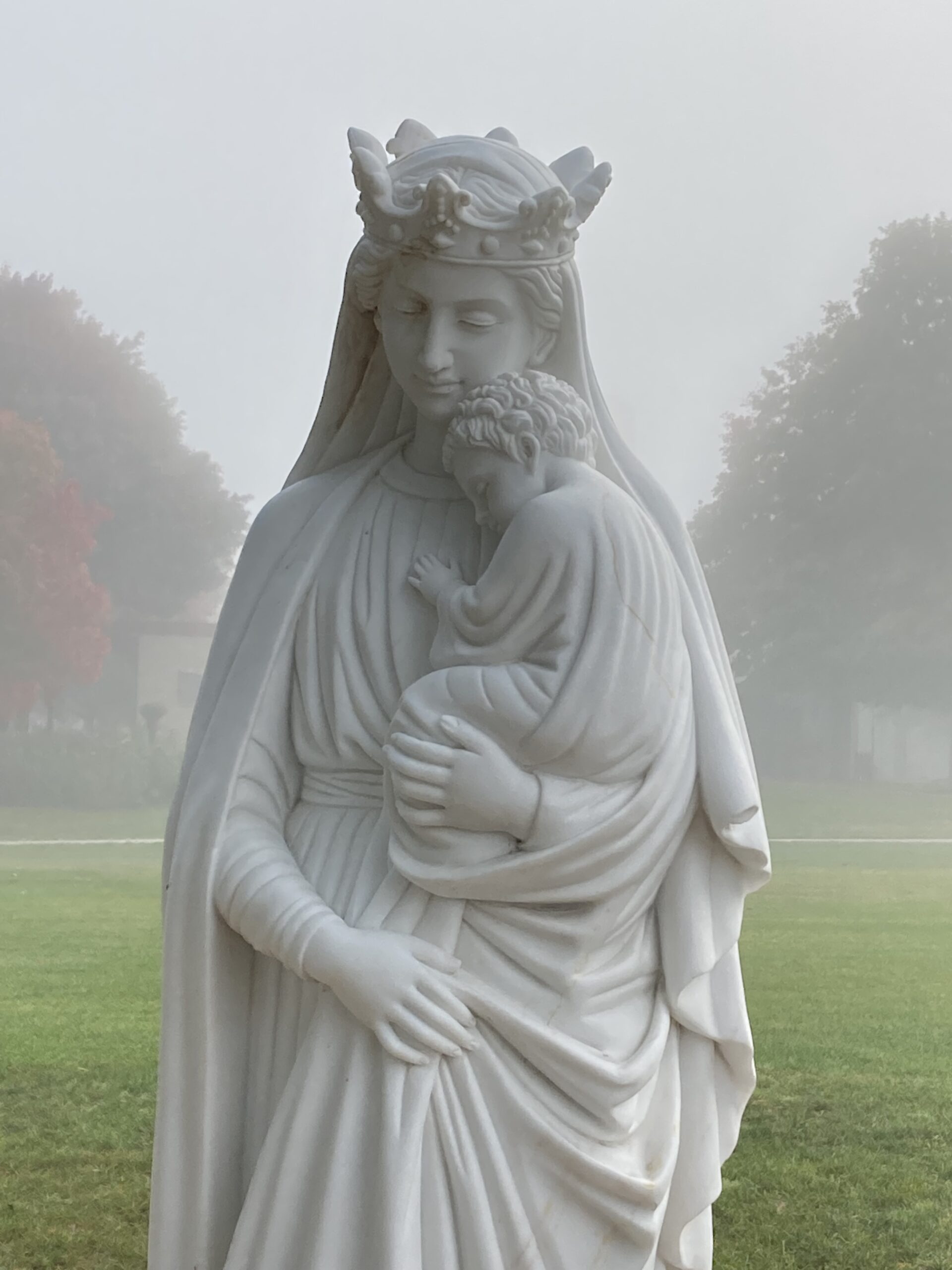 Mary statue and fall leaves